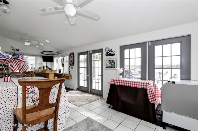 interior space with light tile patterned flooring and ceiling fan