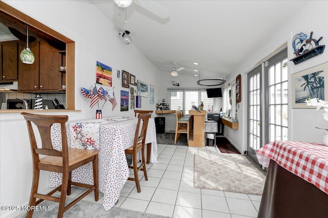 dining room with ceiling fan and light tile patterned floors