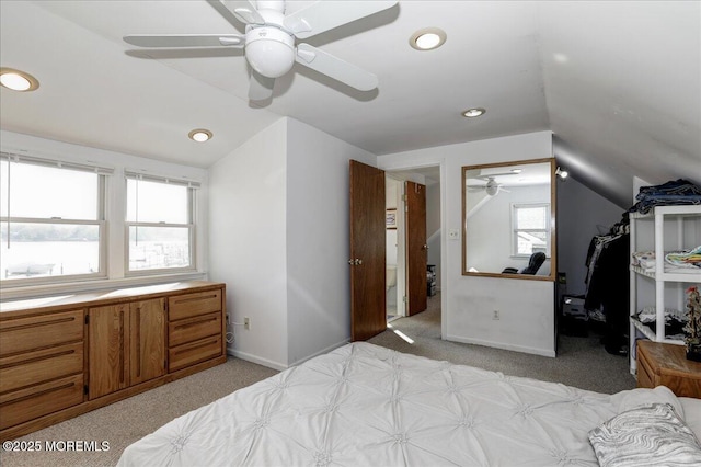 bedroom featuring ceiling fan, light carpet, recessed lighting, baseboards, and lofted ceiling