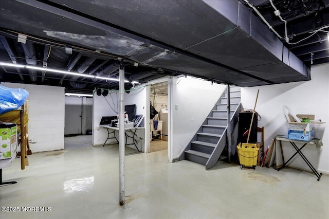 finished below grade area featuring stairway