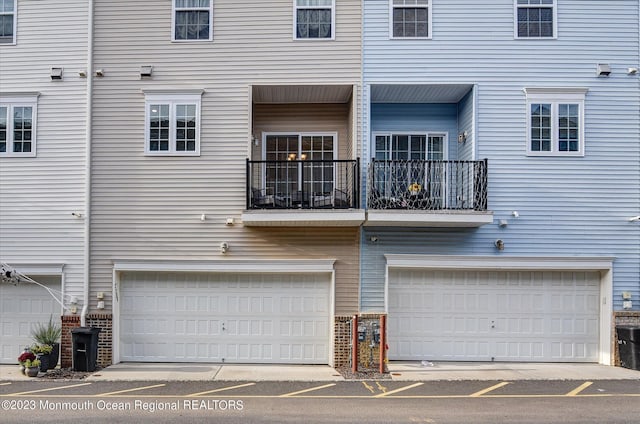back of house with an attached garage