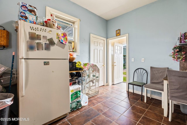 kitchen featuring freestanding refrigerator