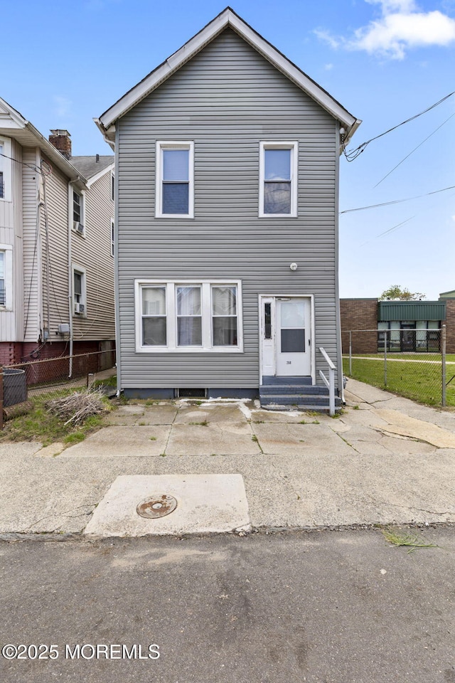 view of front of home with fence and entry steps