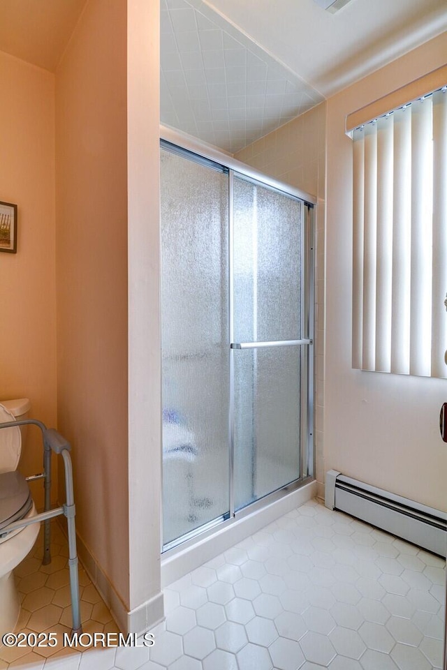 8 Stockport Dr, Toms River, NJ 08757 - bathroom with toilet, a shower stall, a baseboard heating unit, and baseboards