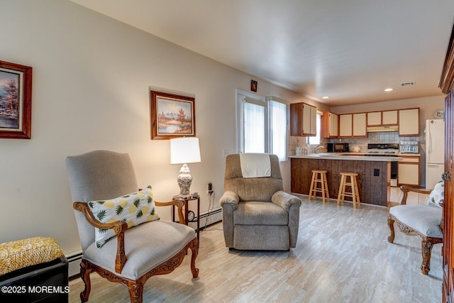 8 Stockport Dr, Toms River, NJ 08757 - sitting room with a baseboard radiator, light wood-style flooring, baseboards, and recessed lighting