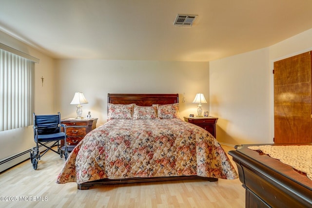 8 Stockport Dr, Toms River, NJ 08757 - bedroom with light wood finished floors and baseboard heating