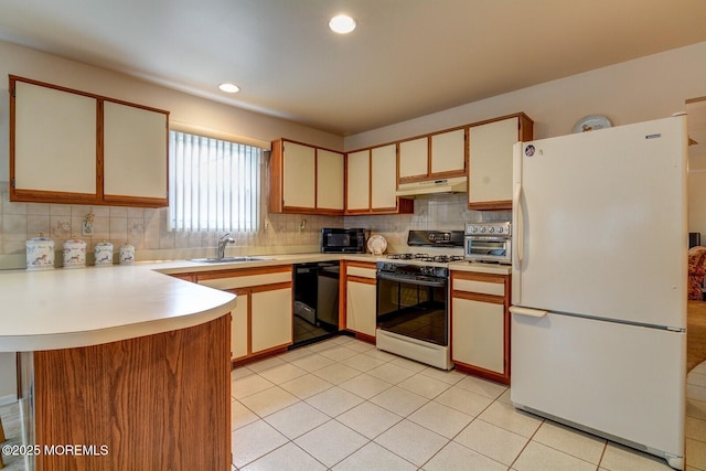 8 Stockport Dr, Toms River, NJ 08757 - kitchen with black appliances, backsplash, light countertops, under cabinet range hood, and a peninsula