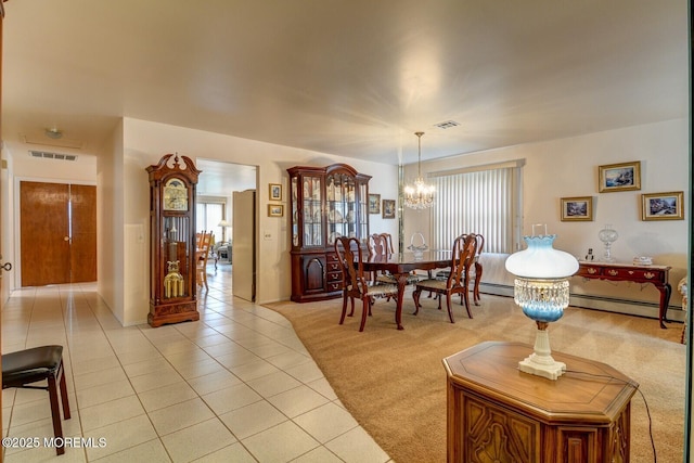 8 Stockport Dr, Toms River, NJ 08757 - dining space featuring a chandelier, light tile patterned floors, and a baseboard heating unit