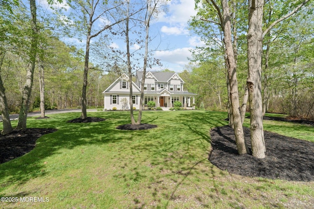 view of front of property featuring a porch and a front yard