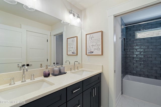 full bath featuring bathtub / shower combination, tile patterned flooring, double vanity, and baseboards