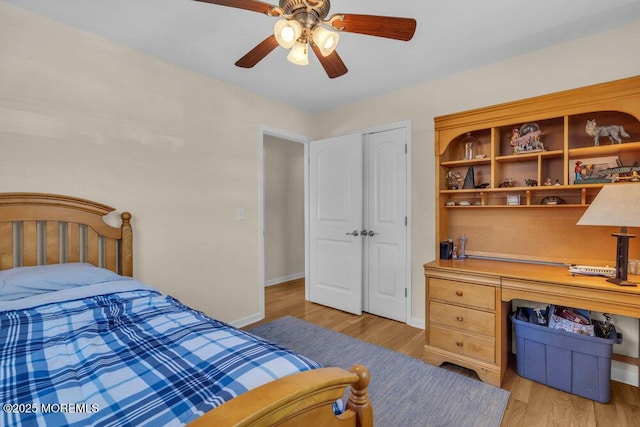 bedroom with baseboards, a ceiling fan, and light wood finished floors