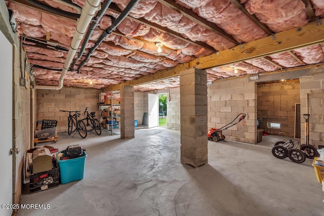 below grade area with concrete block wall