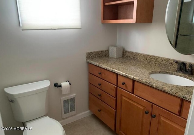 bathroom with toilet, tile patterned floors, visible vents, and vanity