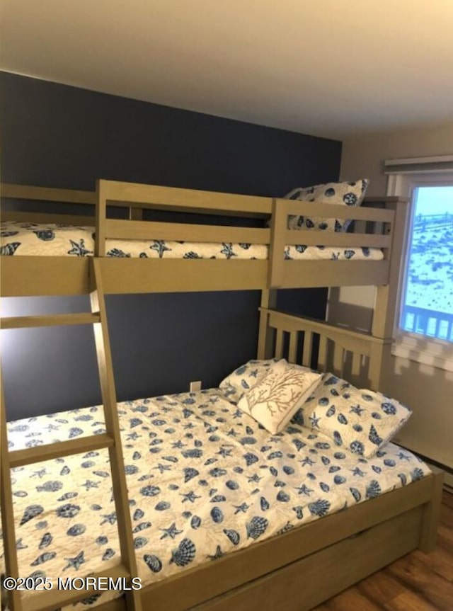 bedroom featuring wood finished floors