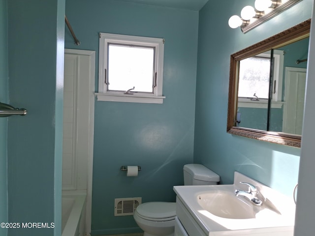 full bathroom with toilet, visible vents, and vanity