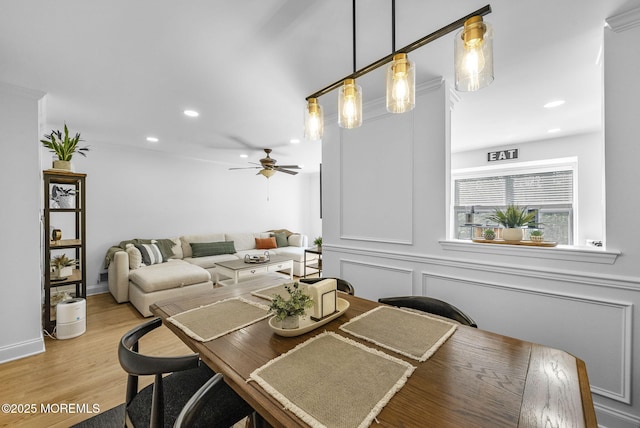 dining room with a ceiling fan, recessed lighting, and light wood finished floors
