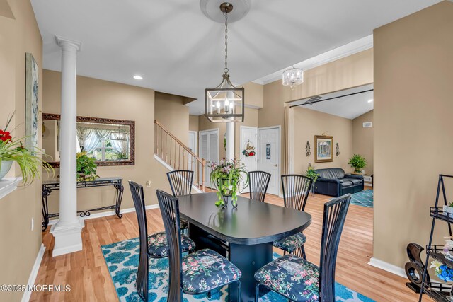dining space with decorative columns, light wood-style flooring, baseboards, a chandelier, and recessed lighting
