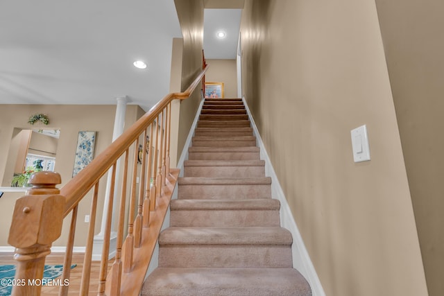staircase with baseboards and recessed lighting