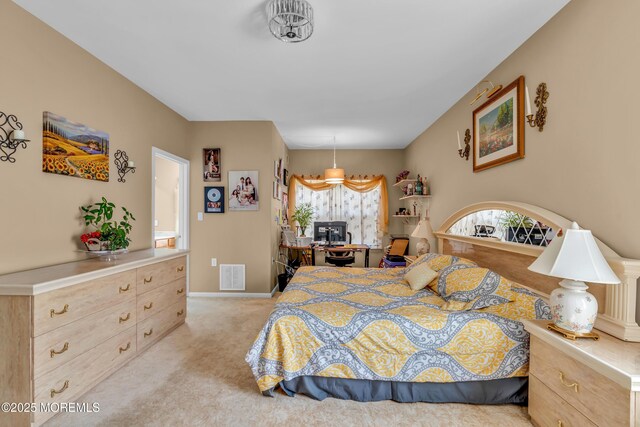bedroom featuring light carpet