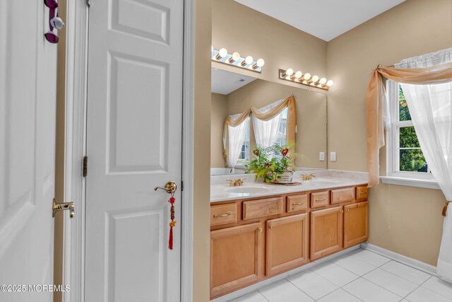 bathroom with double vanity and tile patterned floors