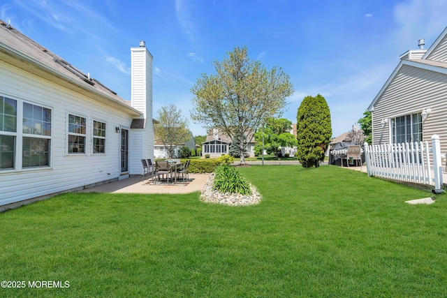 view of grassy yard featuring a patio