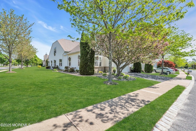 view of property exterior featuring a lawn