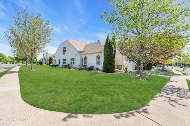 view of home's exterior with a yard