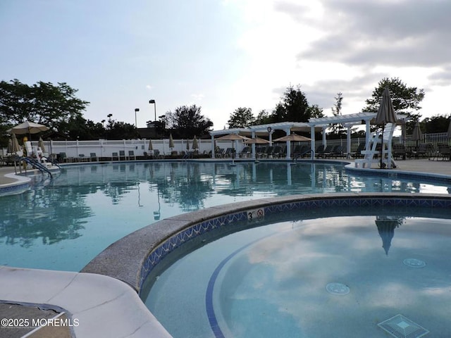 community pool featuring fence