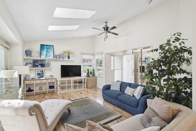 90 Oak Ln, Eatontown, NJ 07724 - living room featuring a skylight, wood finished floors, ceiling fan, high vaulted ceiling, and baseboards