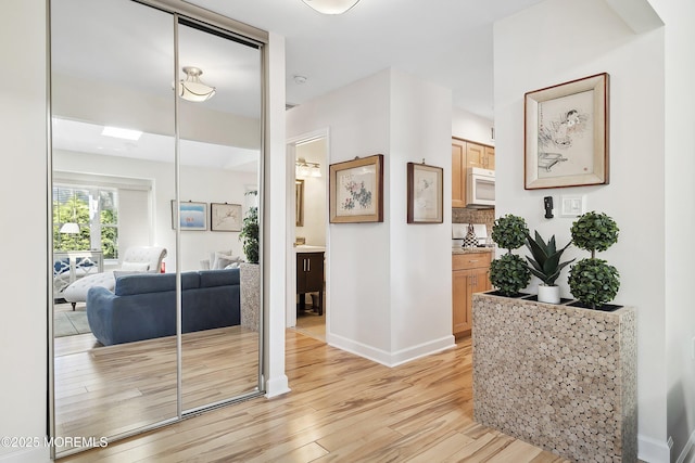 90 Oak Ln, Eatontown, NJ 07724 - hallway featuring light wood finished floors and baseboards