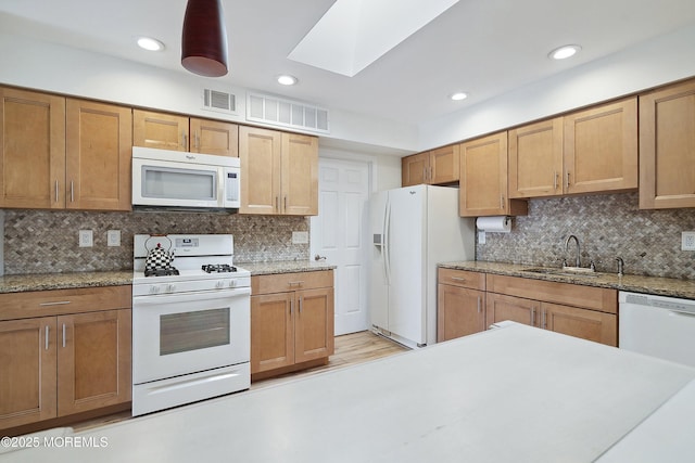 90 Oak Ln, Eatontown, NJ 07724 - kitchen featuring white appliances, a sink, a skylight, backsplash, and recessed lighting