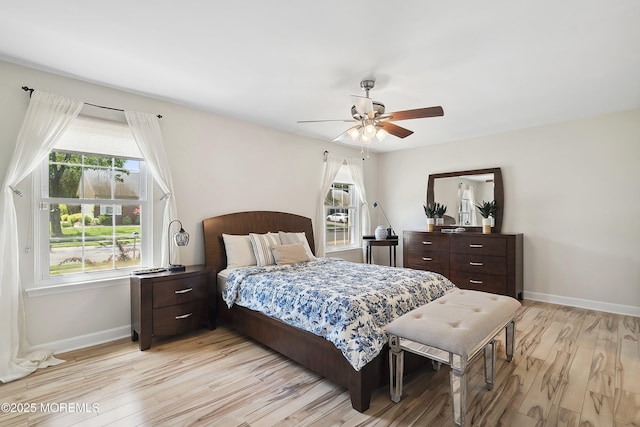 90 Oak Ln, Eatontown, NJ 07724 - bedroom with baseboards, light wood finished floors, and a ceiling fan