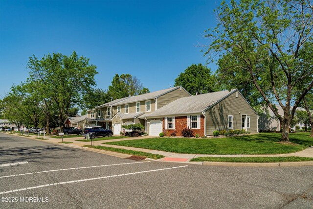 90 Oak Ln, Eatontown, NJ 07724 - view of front of house featuring a front yard, brick siding, and roof with shingles