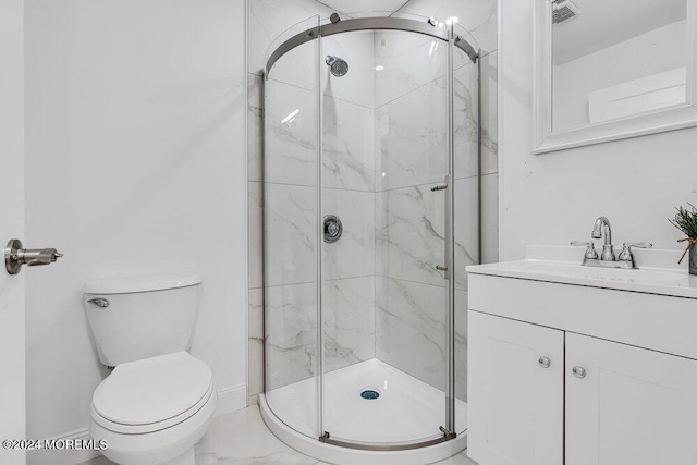 full bathroom with baseboards, vanity, toilet, marble finish floor, and a marble finish shower