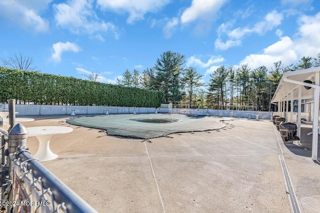 view of pool with fence, a fenced in pool, and a patio area