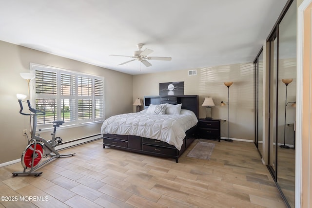 436A New Castle Ct, Manchester, NJ 08759 - bedroom with light wood-style floors, baseboards, a baseboard heating unit, and visible vents