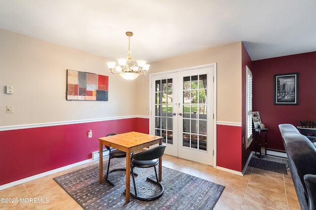 436A New Castle Ct, Manchester, NJ 08759 - tiled dining area featuring french doors, baseboards, a baseboard heating unit, and an inviting chandelier