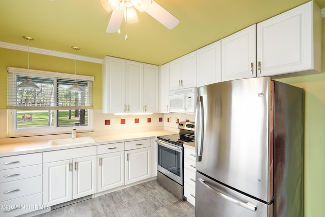 436A New Castle Ct, Manchester, NJ 08759 - kitchen featuring decorative light fixtures, appliances with stainless steel finishes, a sink, light countertops, and white cabinetry