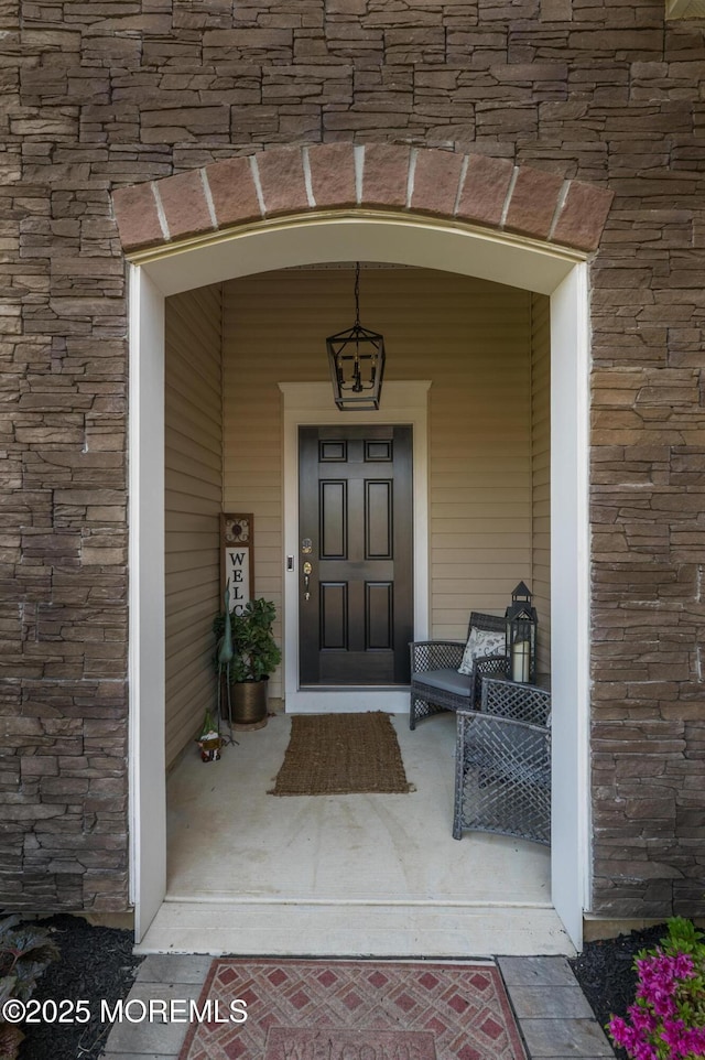 doorway to property with a porch