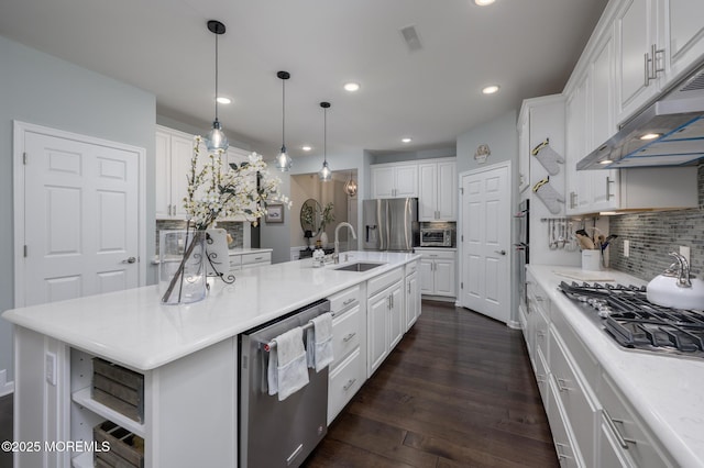 kitchen with open shelves, white cabinetry, under cabinet range hood, a sink, and appliances with stainless steel finishes