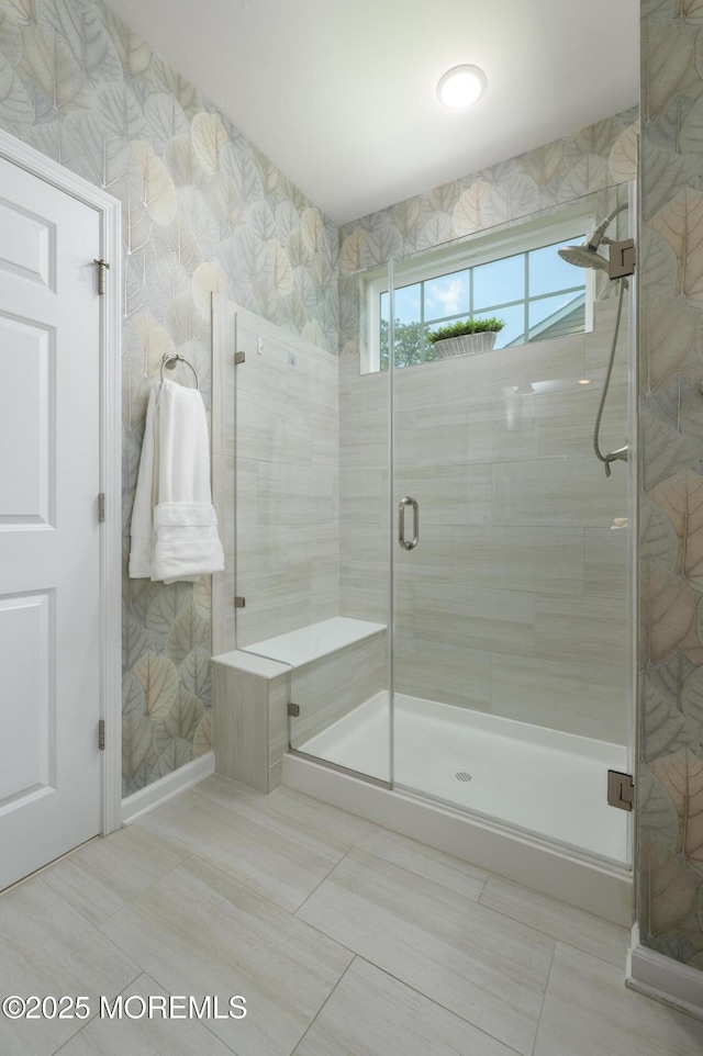 full bath with a shower stall