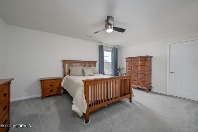 bedroom featuring baseboards, visible vents, and light colored carpet