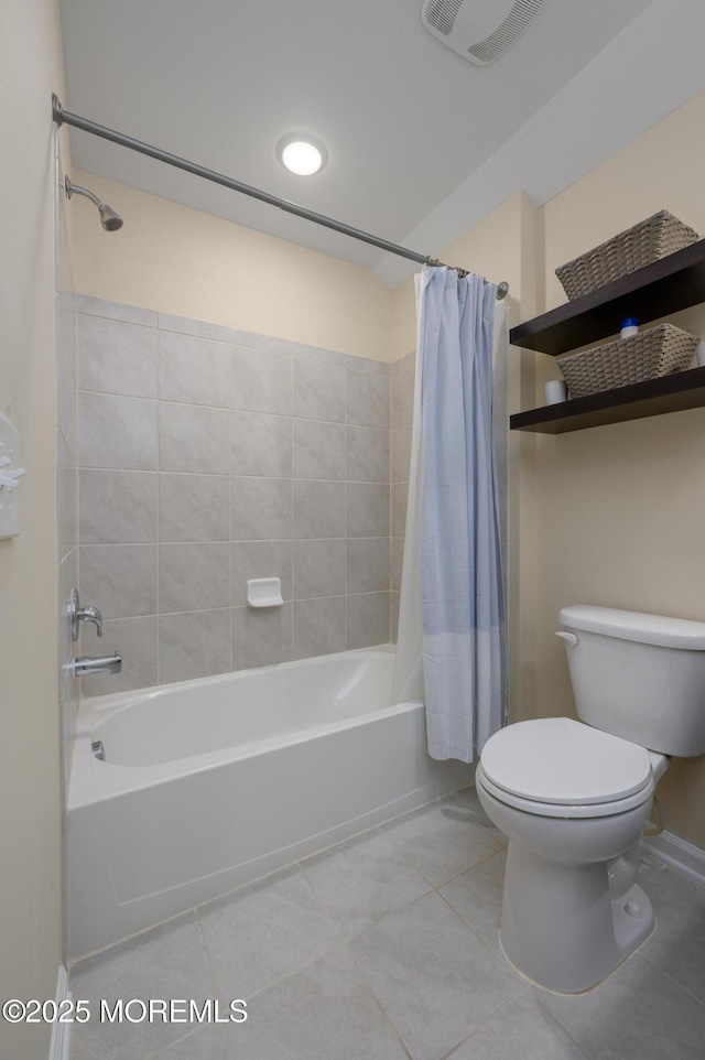 full bath featuring toilet, visible vents, shower / bath combination with curtain, and tile patterned flooring