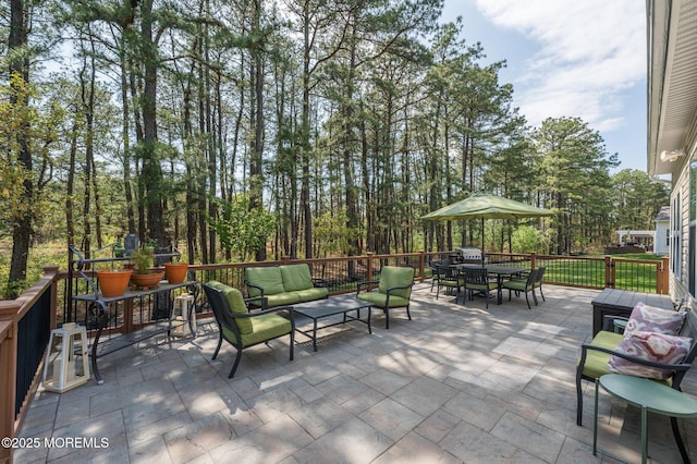 view of patio / terrace with an outdoor living space and outdoor dining space