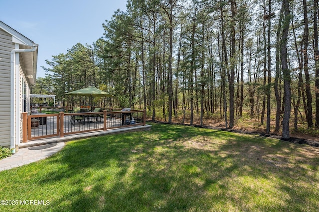 view of yard with a wooden deck