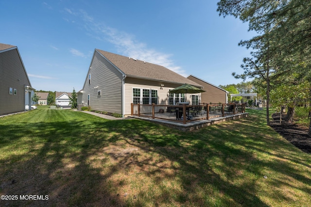 back of house featuring a patio area and a yard