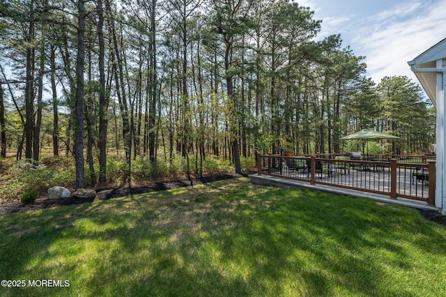 view of yard with a wooden deck