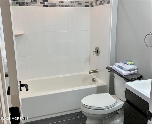 full bath featuring tile patterned flooring, tub / shower combination, toilet, and vanity