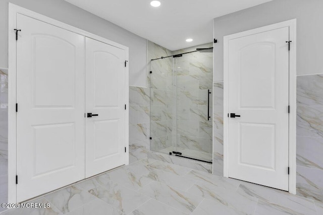 full bathroom featuring recessed lighting, marble finish floor, and a marble finish shower