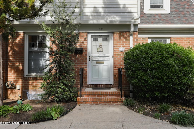 property entrance with brick siding